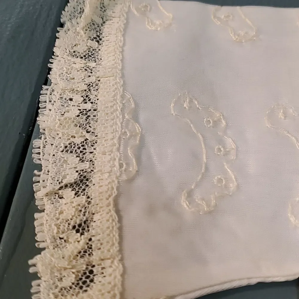 Vintage baby dress with jacket. Trimmed in lace with tie. The jacket has enbroid